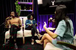 People talking during a podcast at studio iStock-2191212982